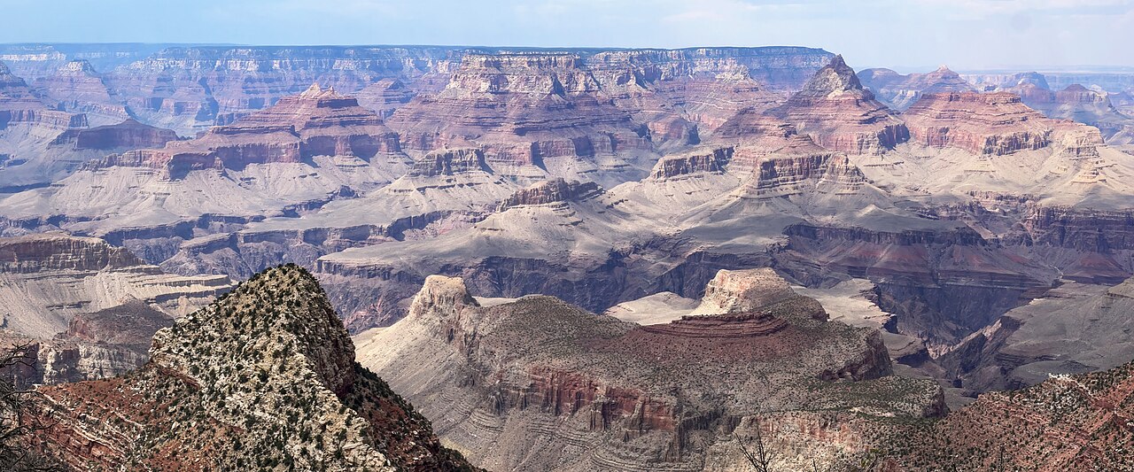 The Grand Canyon seen from the rim, its walls stacked with hundreds of coloured rock layers laid down one on top of another