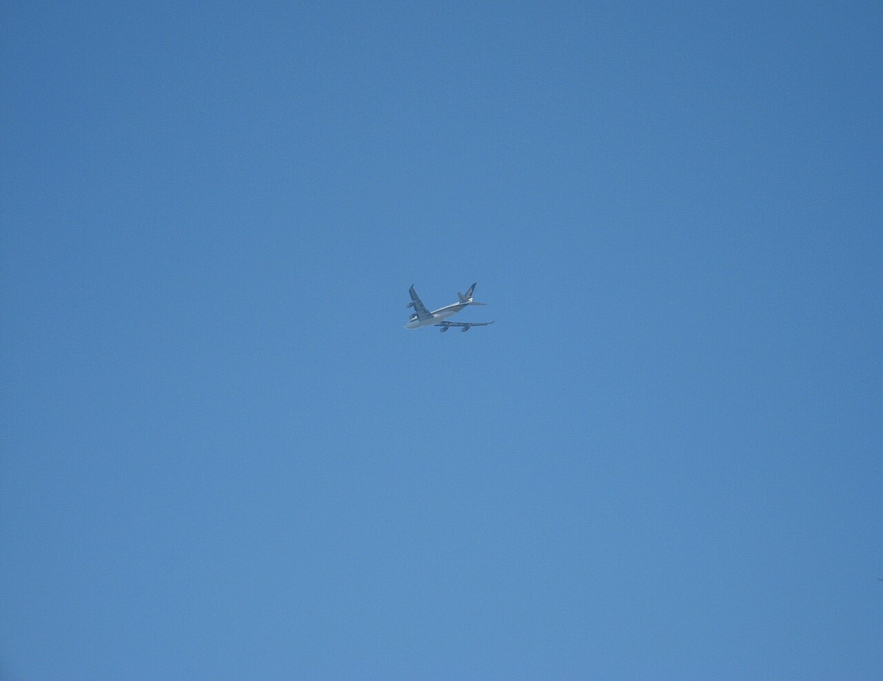 A plane climbing into the sky, where air pressure drops and your ears pop.