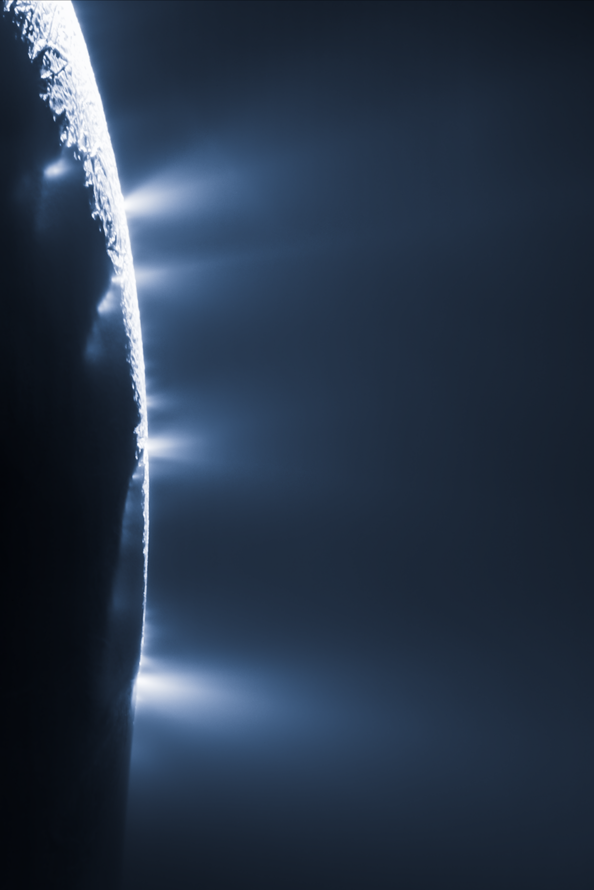 Jets of water ice spraying out from cracks in the icy moon Enceladus, backlit against the dark, hinting at a hidden ocean below