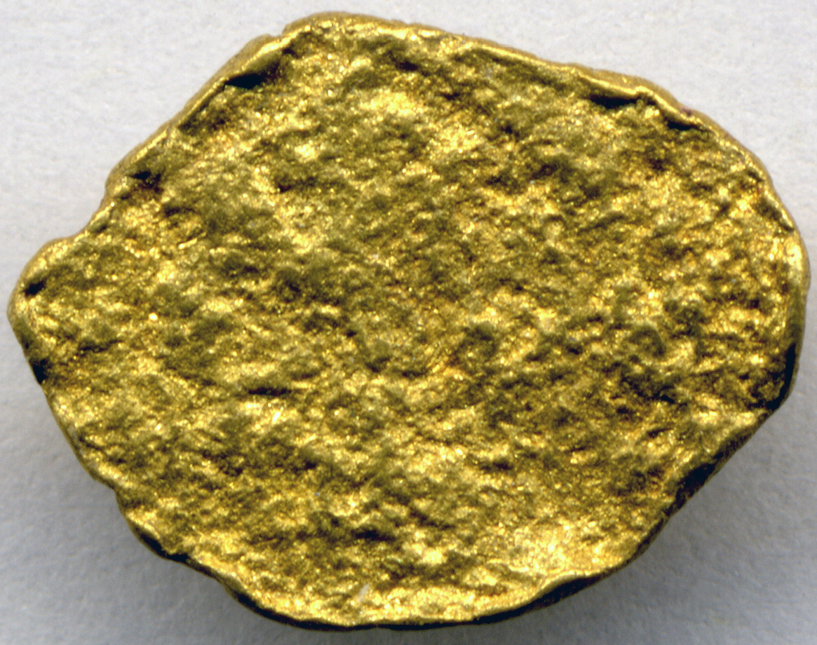 A natural gold nugget gleaming as brightly as the day it formed, a metal that barely reacts with anything