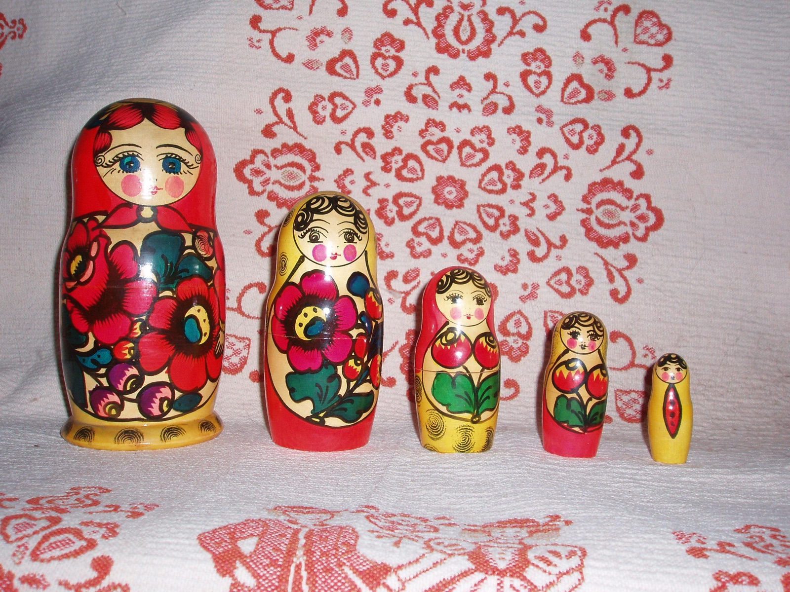 A row of Russian nesting dolls arranged from largest to smallest