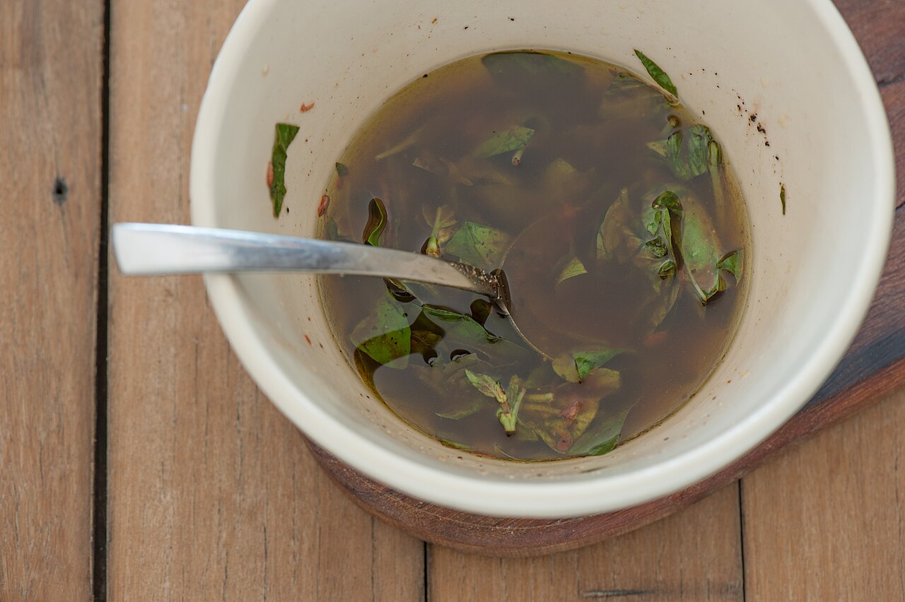 Oil and water (in a vinaigrette) separated into distinct layers.