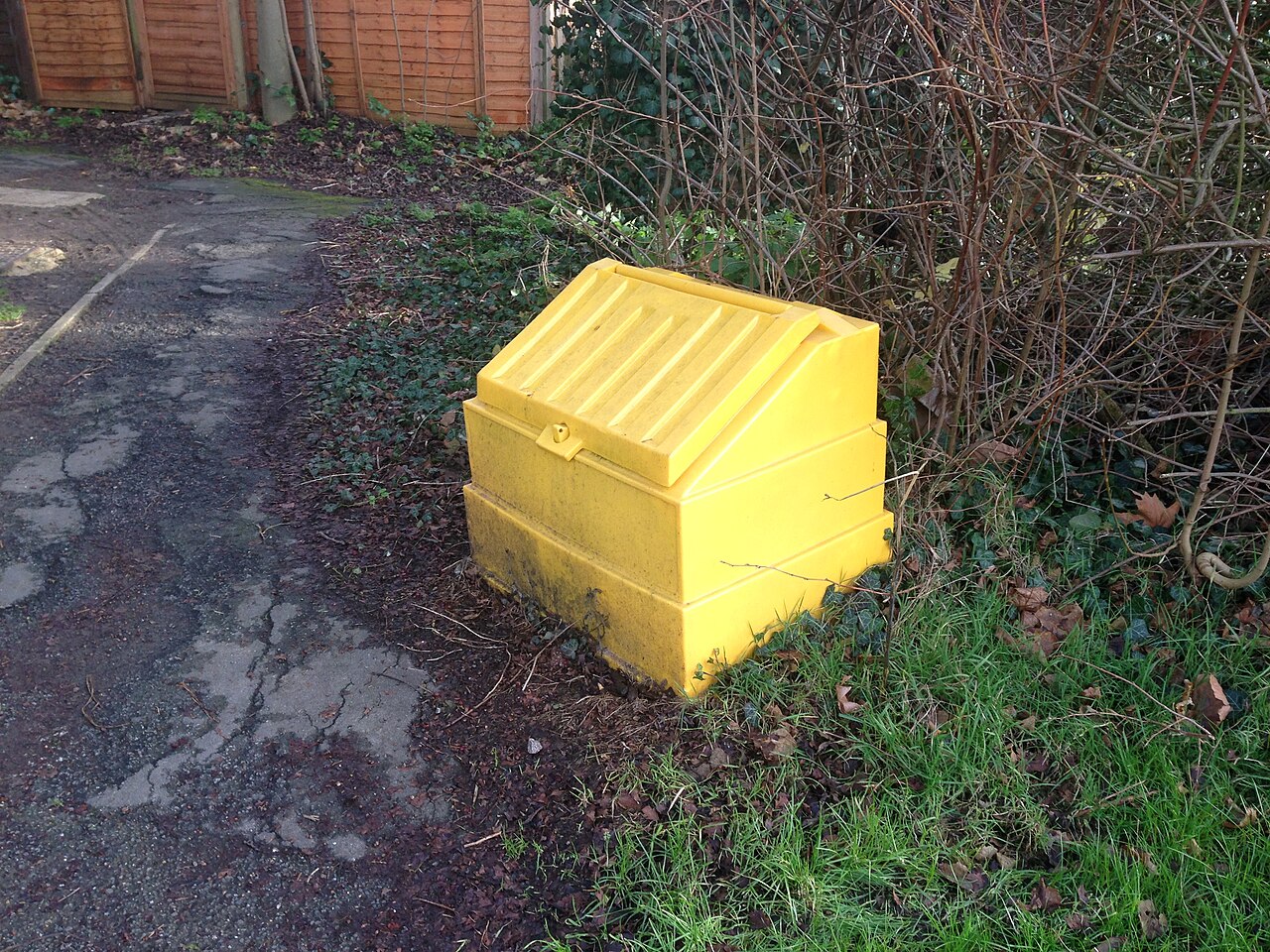 A roadside grit bin holding salt for icy winter roads.