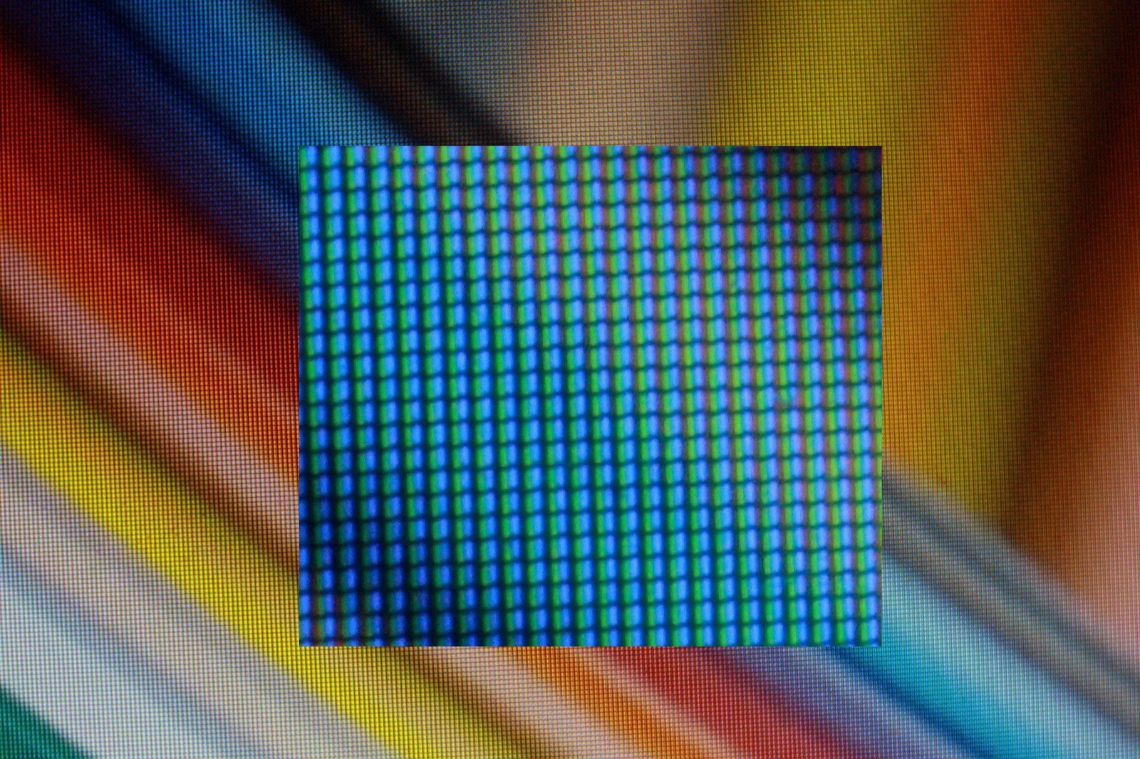 A close-up of a screen, showing it is really made of tiny red, green and blue dots.