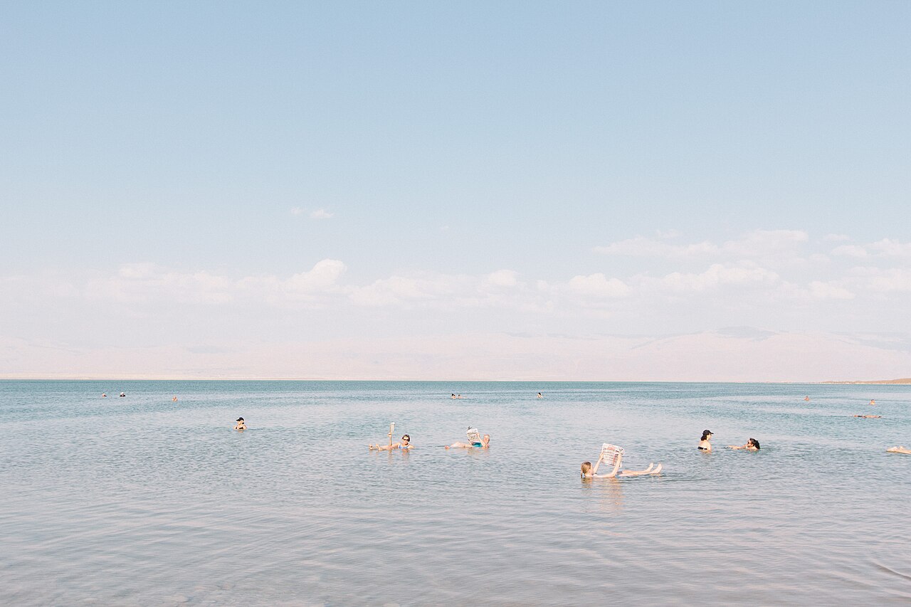 A person floating effortlessly on their back in the salty Dead Sea