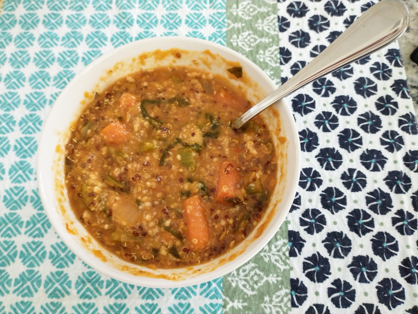 A bowl of thick lentil and vegetable soup, a friendly stand-in for the soupy mush the stomach makes.