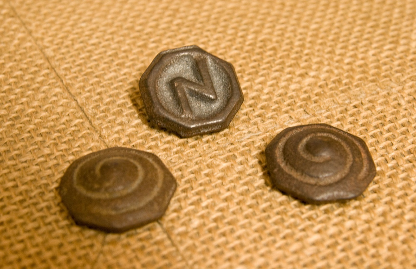 Traditional metal spinning tops.