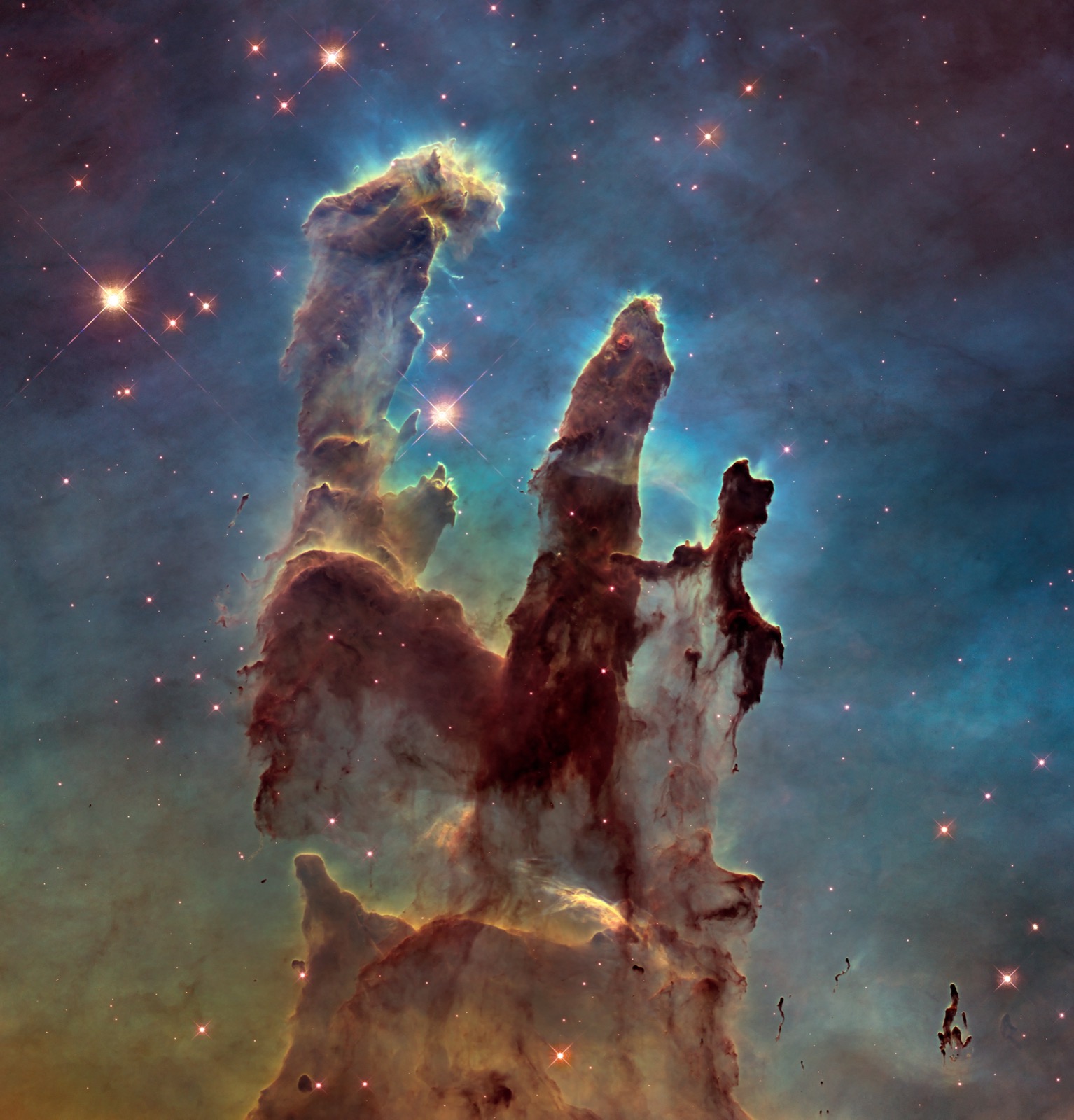 The Pillars of Creation, towers of gas and dust where new stars are being born.