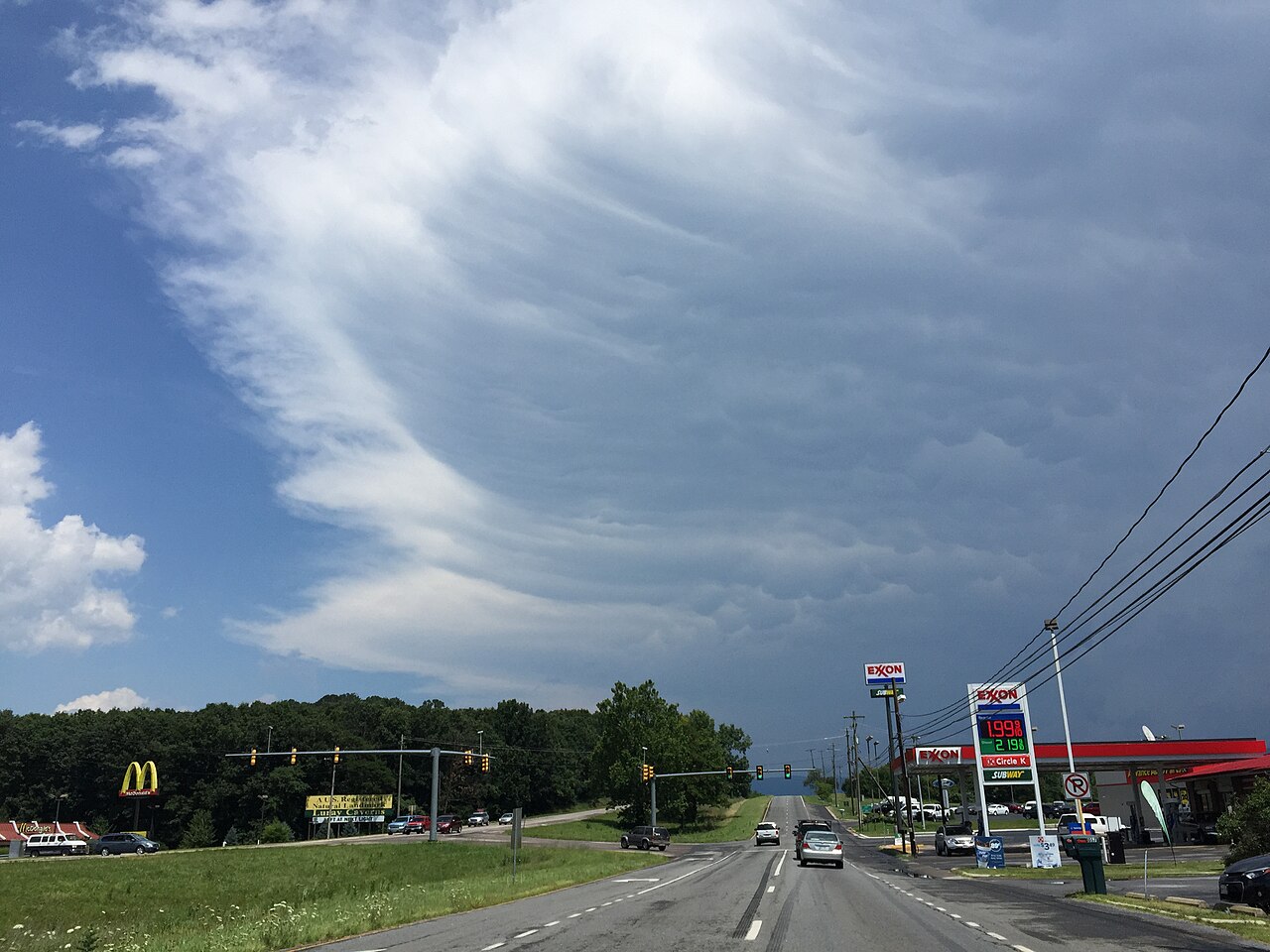A towering thunderstorm cloud with a spreading anvil top.