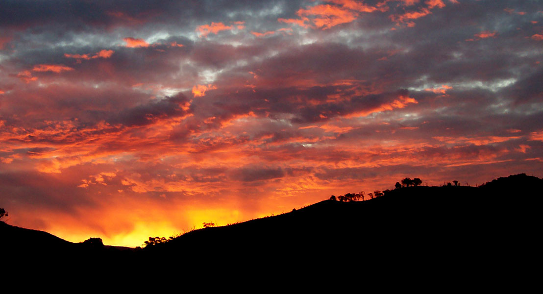A deep red and orange sunset sky