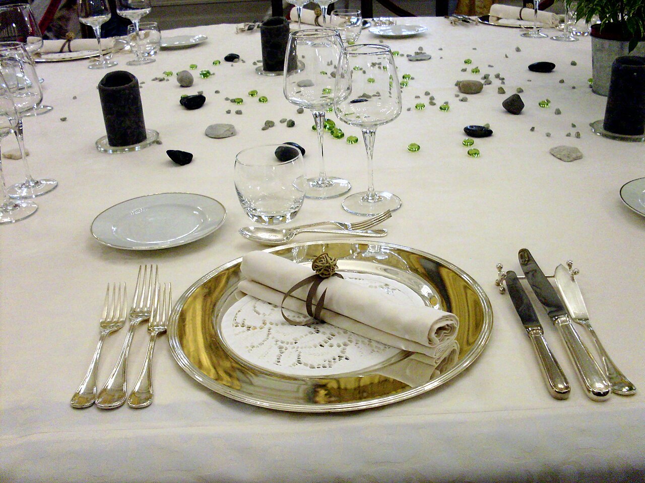 A laid table with plates and cutlery on a cloth