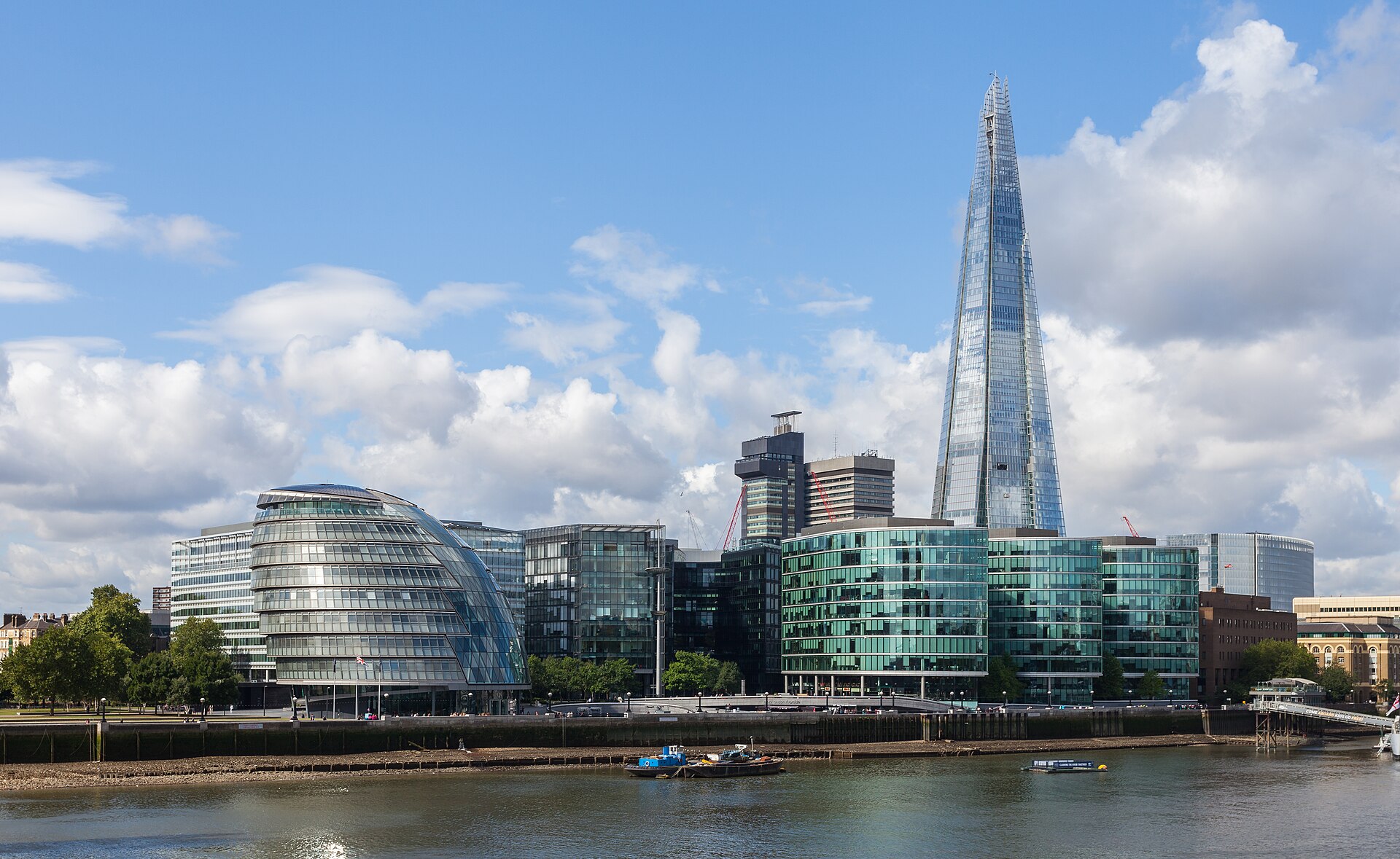 The Shard rising in a tapering glass spike above the London skyline, a tower tall and slender enough to lean a little at the top in a gale