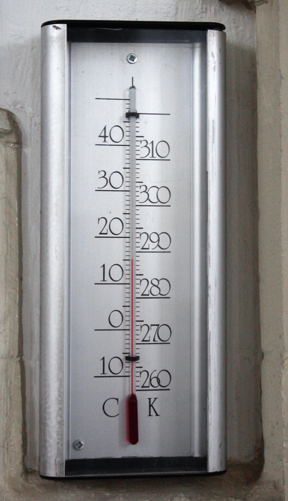 A thermometer with a red liquid column, the tool that tells you whether something has warmed up or cooled down.