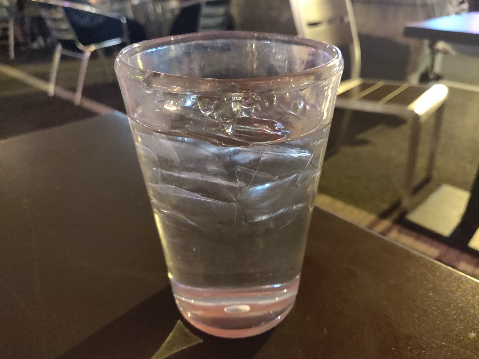 A clear glass of water on a table